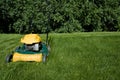 Lawnmower, cutting green grass close-up with space Royalty Free Stock Photo