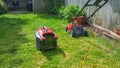 Lawnmower with full grass box Royalty Free Stock Photo