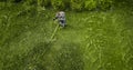 The lawnmower man mows the lawn the view from the top Royalty Free Stock Photo