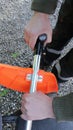 The lawnmower`s hands holding the tool handle Royalty Free Stock Photo