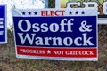 LAWRENCEVILLE, UNITED STATES - Dec 22, 2020: Georgia Senate runoff election signs along the side of the road near a polling