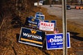 LAWRENCEVILLE, UNITED STATES - Dec 22, 2020: Georgia Senate runoff election signs along the side of the road near a polling