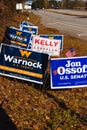 LAWRENCEVILLE, UNITED STATES - Dec 22, 2020: Georgia Senate runoff election signs along the side of the road near a polling