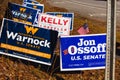 LAWRENCEVILLE, UNITED STATES - Dec 22, 2020: Georgia Senate runoff election signs along the side of the road near a polling