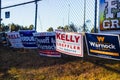 LAWRENCEVILLE, UNITED STATES - Dec 22, 2020: Georgia Senate runoff election signs along the side of the road near a polling