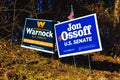 LAWRENCEVILLE, UNITED STATES - Dec 22, 2020: Georgia Senate runoff election signs along the side of the road near a polling