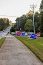 LAWRENCEVILLE, UNITED STATES - Nov 03, 2020: Campaign signs along the side of the road near a polling location in Gwinnett County