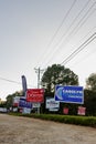 LAWRENCEVILLE, UNITED STATES - Nov 03, 2020: Campaign signs along the side of the road near a polling location in Gwinnett County