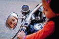 Laws for child drivers under 18 concept. Portrait of little biker child girl on a motorcycle Royalty Free Stock Photo