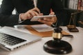 Lawyer business man working with tablet and paperwork on his desk in office workplace for consultant lawyer in office Royalty Free Stock Photo