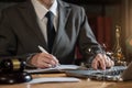 Lawyer businessman working or reading lawbook in office.