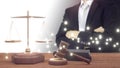 lawyer and golden Scales of Justice with Judgment Hammer and Law Books,fair judgment under the law,court to judge Royalty Free Stock Photo