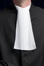 Lawyer in gown with jabot hands close up judge