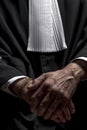 Lawyer in gown with jabot hands close up judge