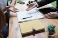 Lawyer hands important documents to couple to sign