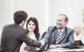 Lawyer and a handshake of business partners after discussing the terms of the contract