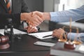 Male lawyer with client shaking hands in office Royalty Free Stock Photo