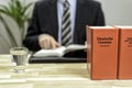 Lawyer in his office with books Royalty Free Stock Photo