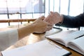 Lawyer or judge with gavel and balance handshake with client