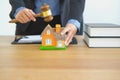 lawyer with judge gavel knocking house model. real estate dispute & property auction concept Royalty Free Stock Photo