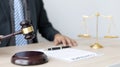 Lawyer or judge holding Hammer prepares to judge the case with justice Royalty Free Stock Photo