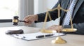 Lawyer or judge holding Hammer prepares to judge the case with justice Royalty Free Stock Photo