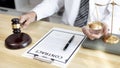 Lawyer or judge holding Hammer prepares to judge the case with justice Royalty Free Stock Photo