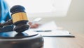 Lawyer judge reading documents at desk in courtroom Royalty Free Stock Photo