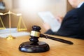 Lawyer judge reading documents at desk in courtroom working on w Royalty Free Stock Photo