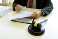 Lawyer or judge  was looking at the document with a magnifying glass Royalty Free Stock Photo