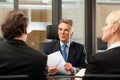 Lawyer or notary with clients in his office Royalty Free Stock Photo