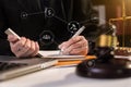 Lawyer office. gavel of Justice with scales and lawyer working on a laptop. Royalty Free Stock Photo