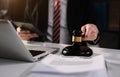 Lawyer office. gavel of Justice with scales and lawyer working on a laptop. Royalty Free Stock Photo