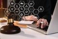 Lawyer office. gavel of Justice with scales and lawyer working on a laptop. Royalty Free Stock Photo