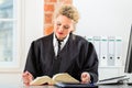 Lawyer in office with law book working on desk Royalty Free Stock Photo