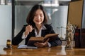 Lawyer`s Office. The goddess of justice with scales and lawyers working on law, advice, and justice. Female lawyer at work with ha Royalty Free Stock Photo