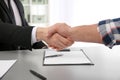 Lawyer shaking hands with client in office Royalty Free Stock Photo