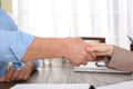 Lawyer shaking hands with client in office Royalty Free Stock Photo