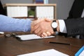 Lawyer shaking hands with client in office Royalty Free Stock Photo