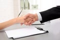 Lawyer shaking hands with client in office Royalty Free Stock Photo