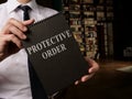 Lawyer shows info about Protective Order rules. Royalty Free Stock Photo