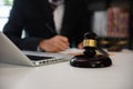 Lawyer signing important legal document on desk at office Royalty Free Stock Photo