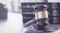 Office desk with books and gavel. Royalty Free Stock Photo