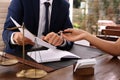 Lawyer working with client at table in office Royalty Free Stock Photo