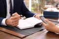 Lawyer working with client at table in office Royalty Free Stock Photo