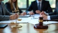 Lawyers, officials in professional discussion room. Focused meeting on documents. Gavel, scales of justice symbolize fairness in