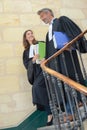 Lawyers walking down stairs in courthouse Royalty Free Stock Photo