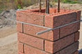 Lay bricks and blocks correctly. Closeup.