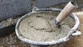 Lay bricks with cement mixing tub, mortar concrete Royalty Free Stock Photo