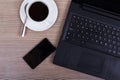 Lay flat image of a laptop and coffee cup
